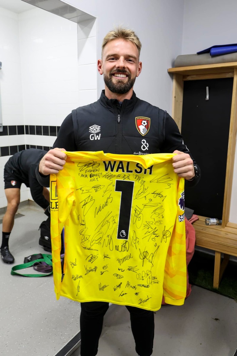 A PCS team moment — signed Premier League jersey
